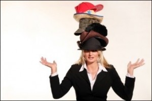 woman wearing multiple hats