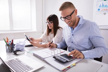 man and woman doing bookkeeping
