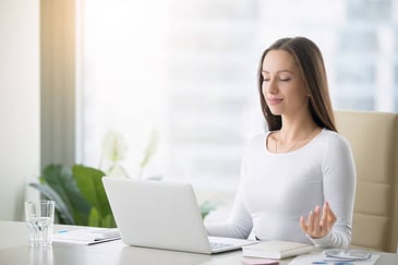 woman with closed eyes meditating