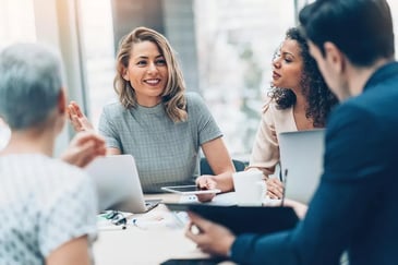 a group of professionals in a meeting