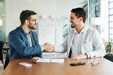 two men shaking hands