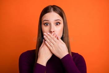 woman covering her mouth