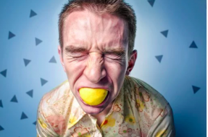 man with a lemon in his mouth